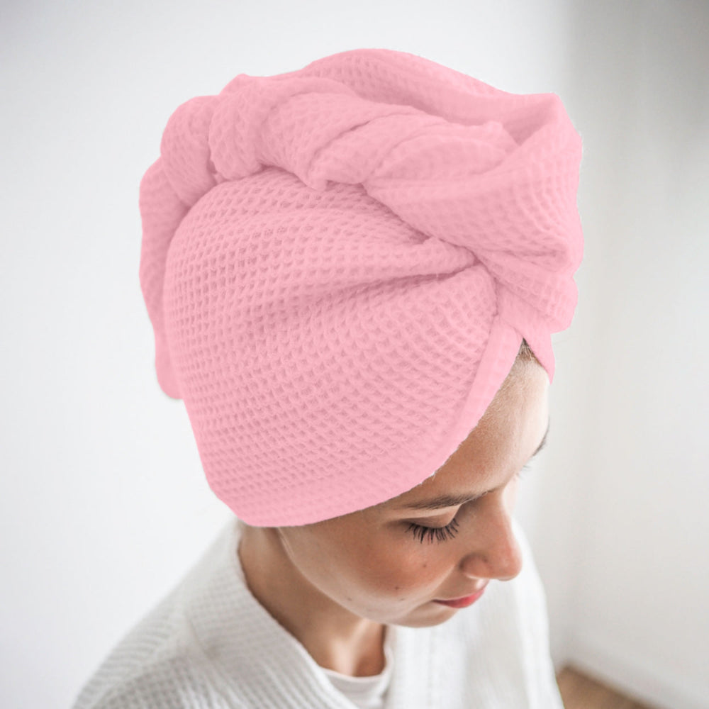 Pink cotton hair wrap towel worn after shower