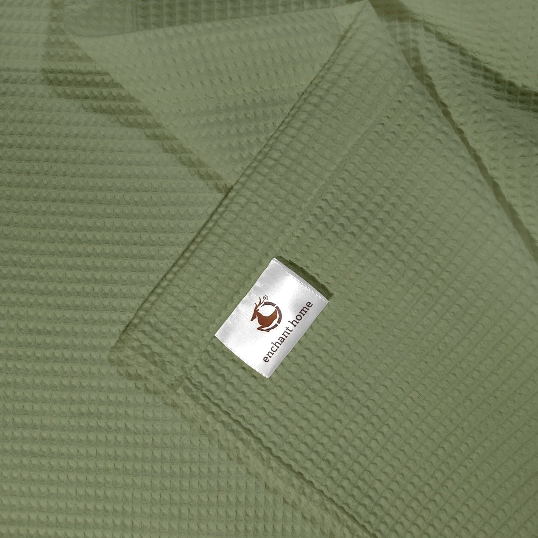Sage green cotton waffle hand towel folded view