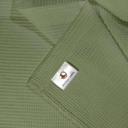 Sage green cotton waffle hand towel folded view