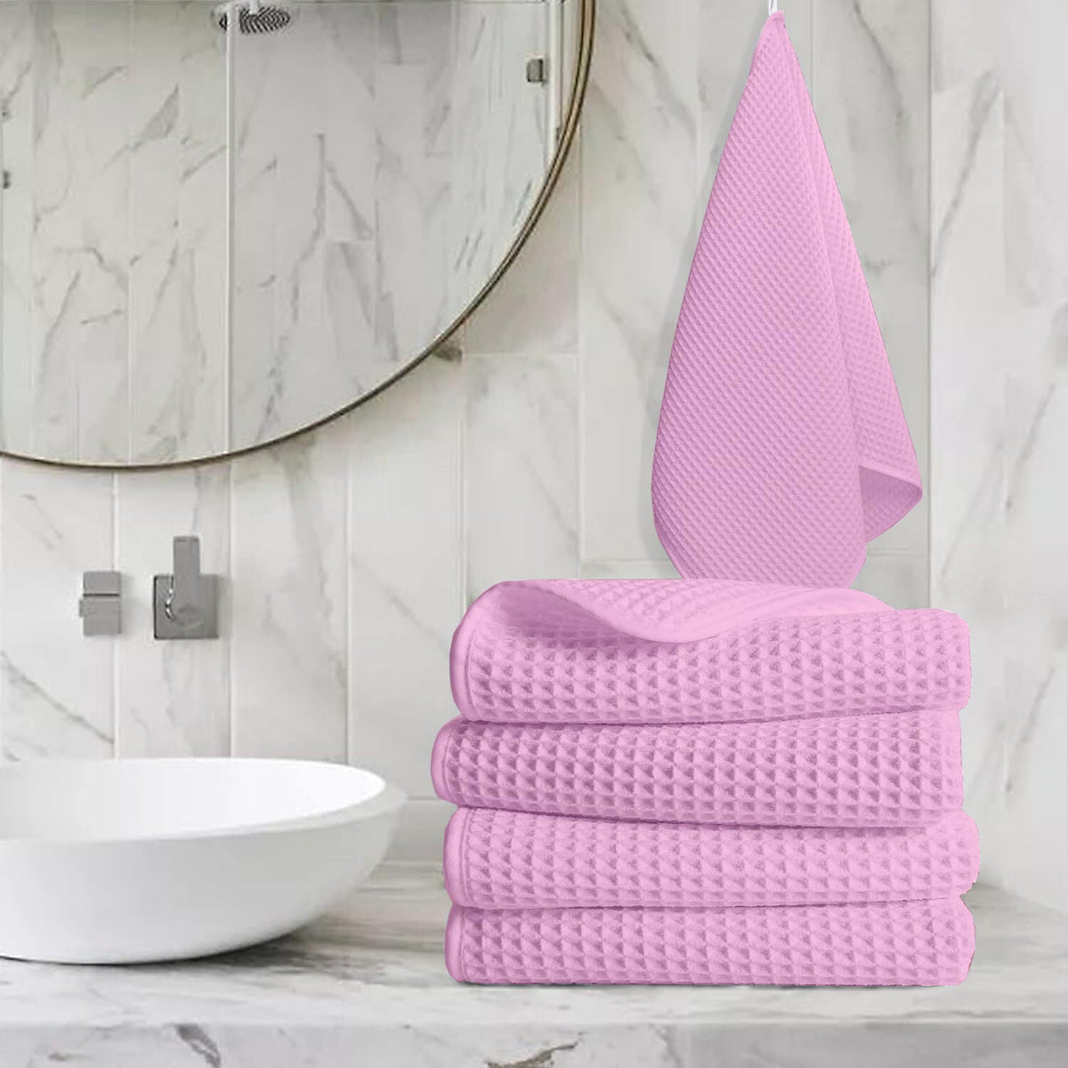 Pure cotton waffle hand towel in pink on towel rail