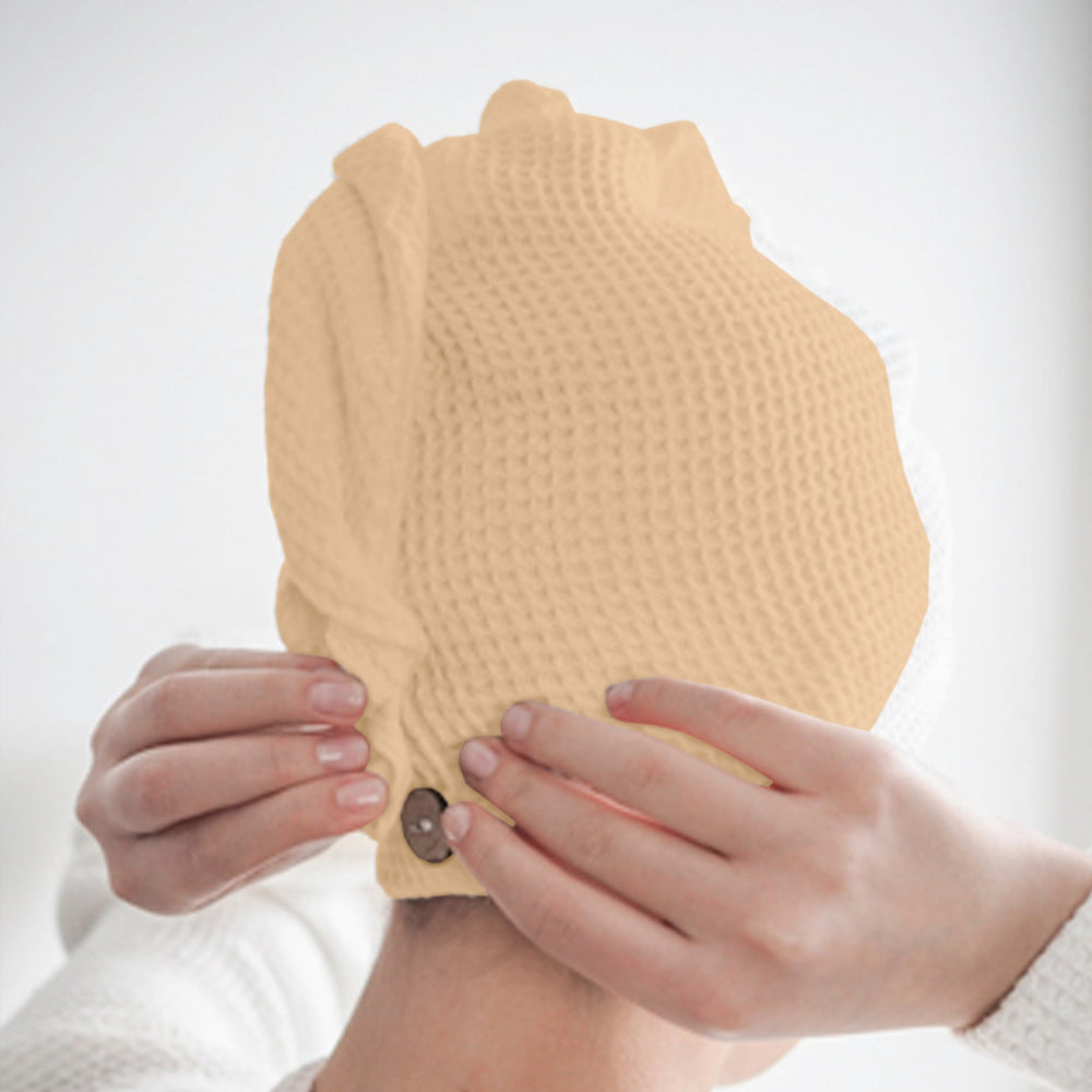 Beige cotton hair wrap towel spread flat