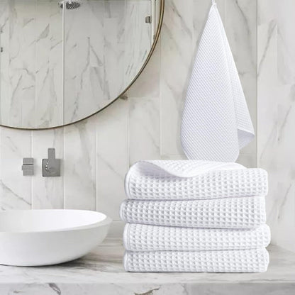 Pure cotton waffle hand towel in white on towel rail