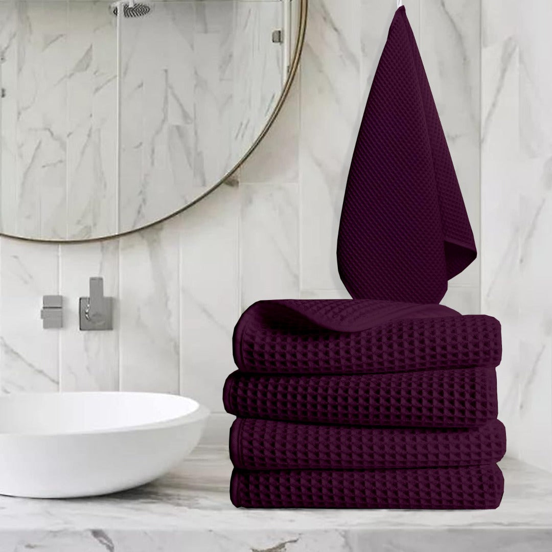 Pure cotton waffle hand towel in wine on towel rail