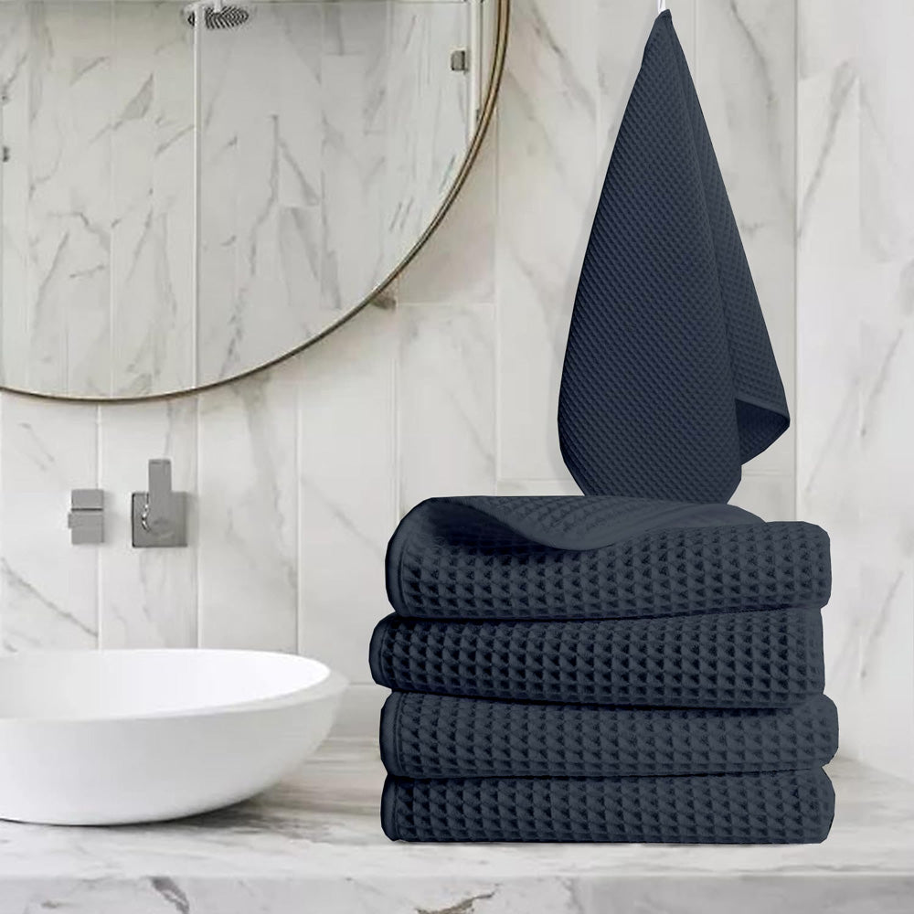 Pure cotton waffle hand towel in charcoal on towel rail