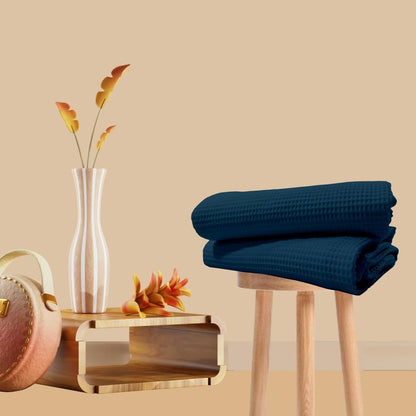 Navy blue cotton waffle bath towel folded view