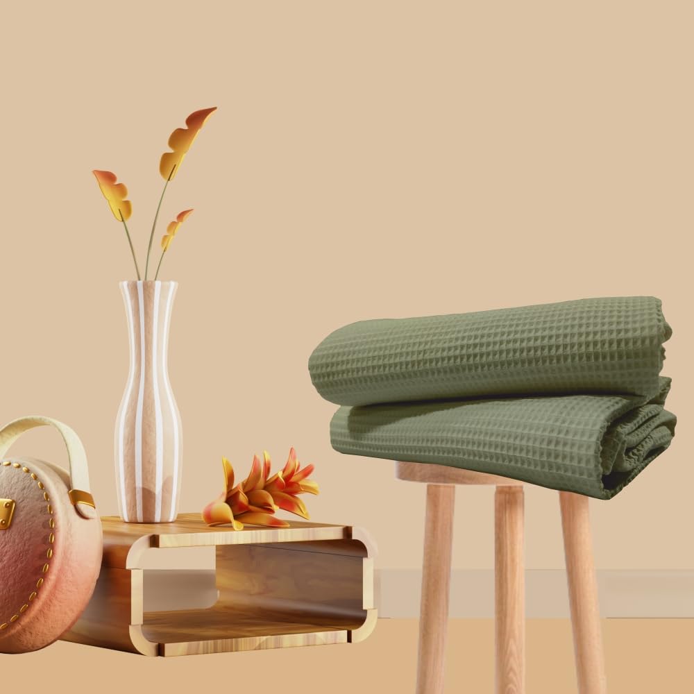 Sage green cotton waffle bath towel folded view