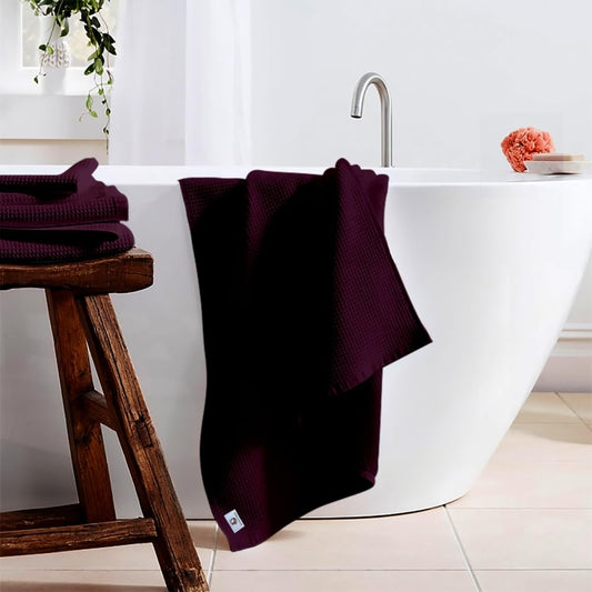Pure cotton waffle bath towel in wine hanging in bathroom