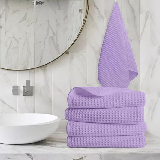 Pure cotton waffle hand towel in lavender on towel rail