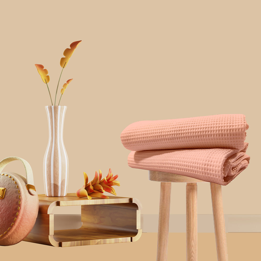 Peach cotton waffle bath towel folded view